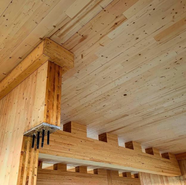 A wooden ceiling with some wood beams and a beam