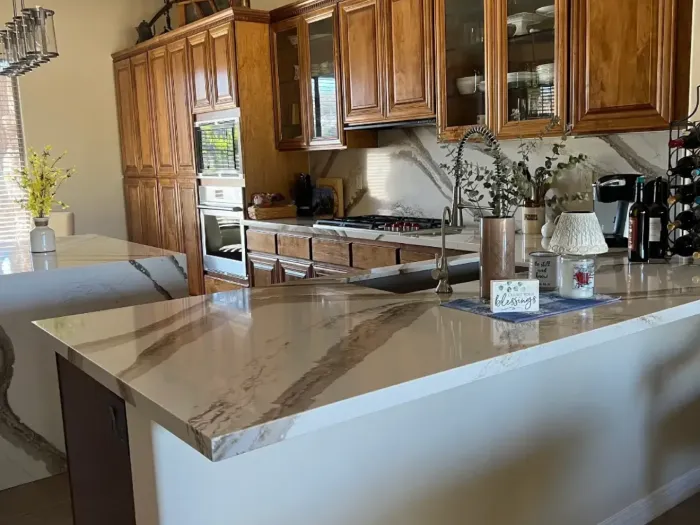 custom cabinetry2 Remodeled bathroom with double vanity, granite countertops, white cabinetry, and glass shower.