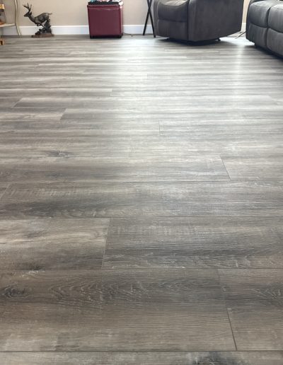 New wood-look plank flooring installed throughout a residential living room